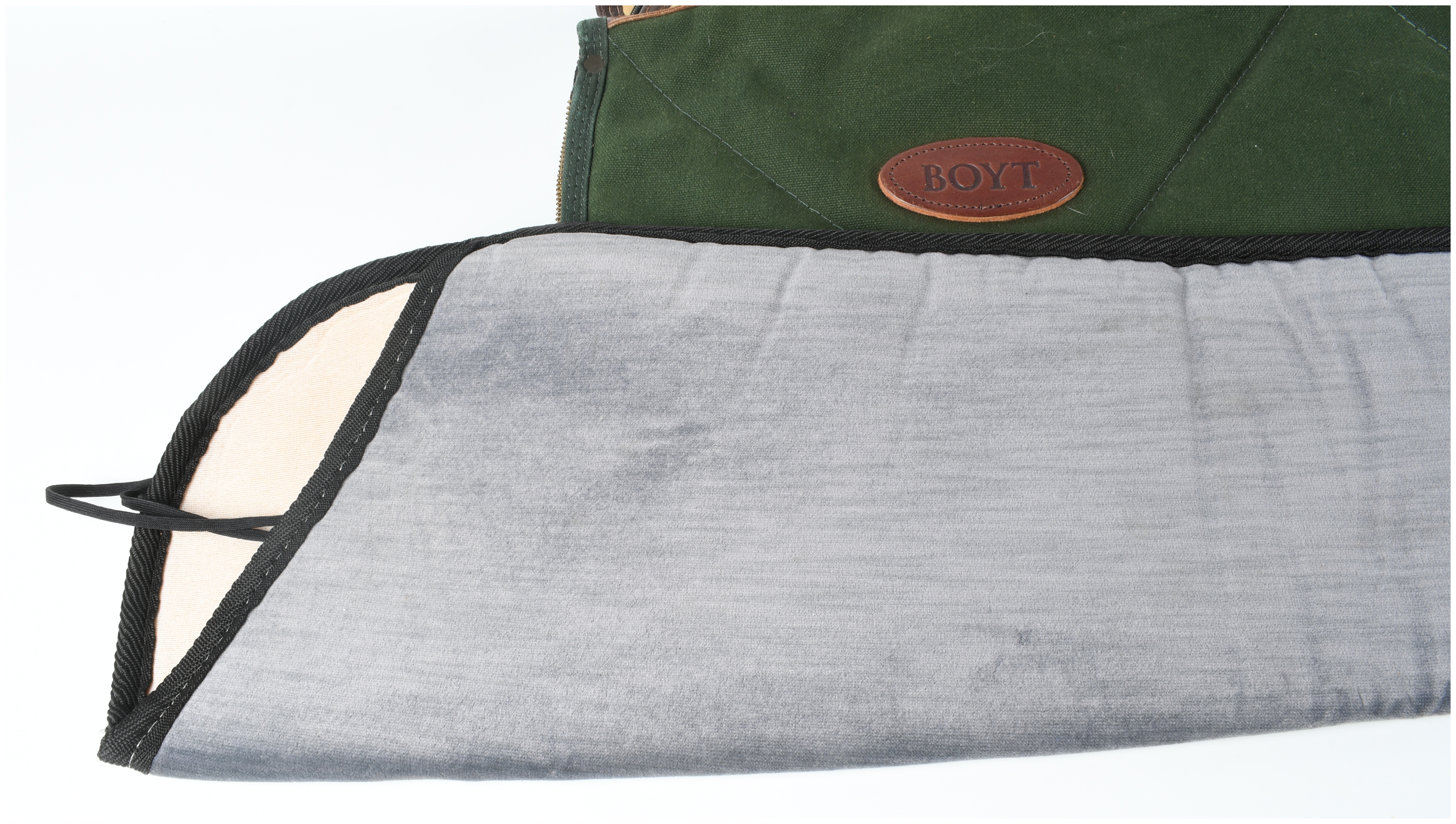 A Set of Four Gun Cases and Protective Slips Including Boyt