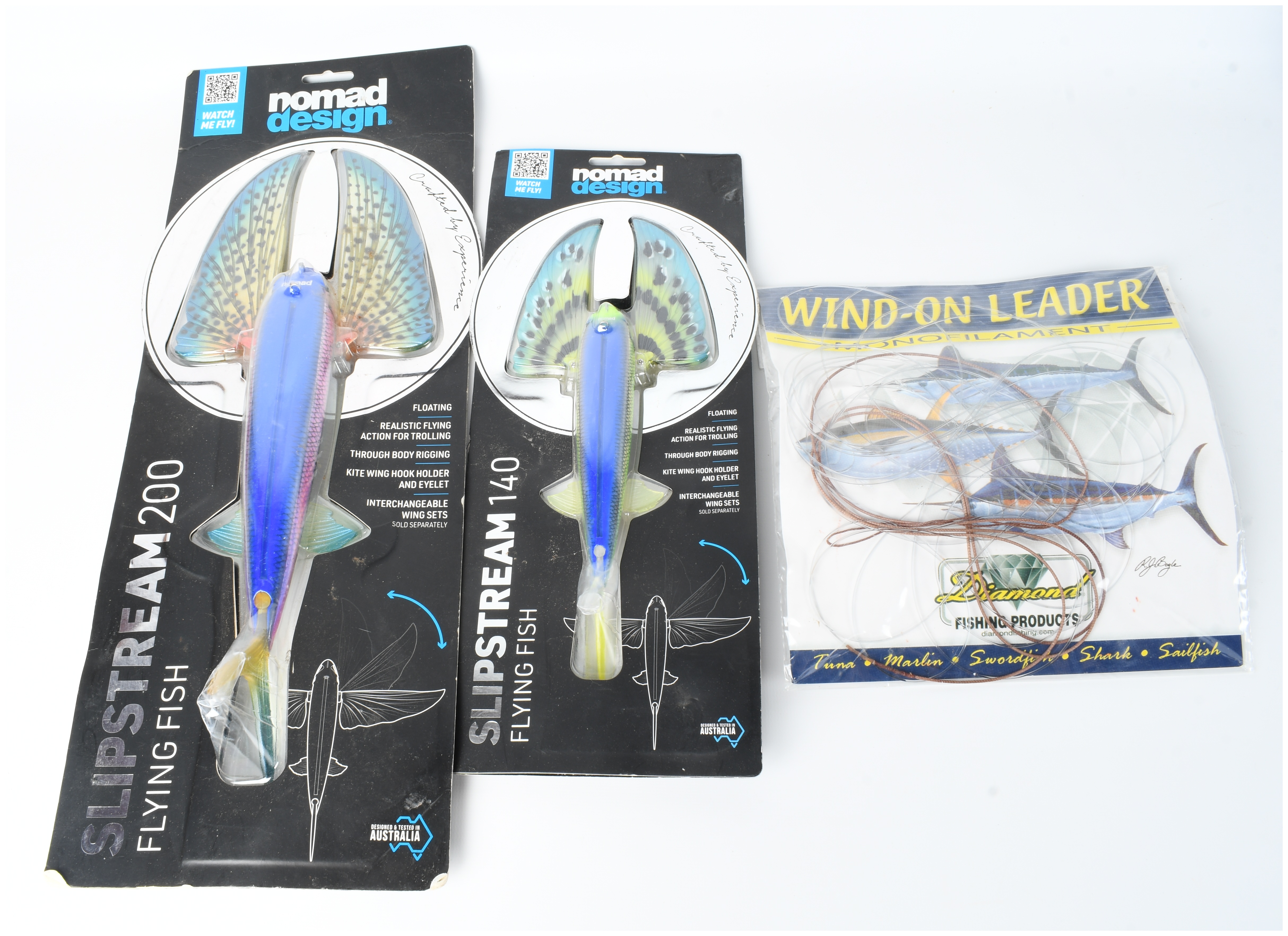 Three Pieces of Offshore Fishing Tackle Including Nomad Design Slipstream Flying Fish Lures and Diamond Leader