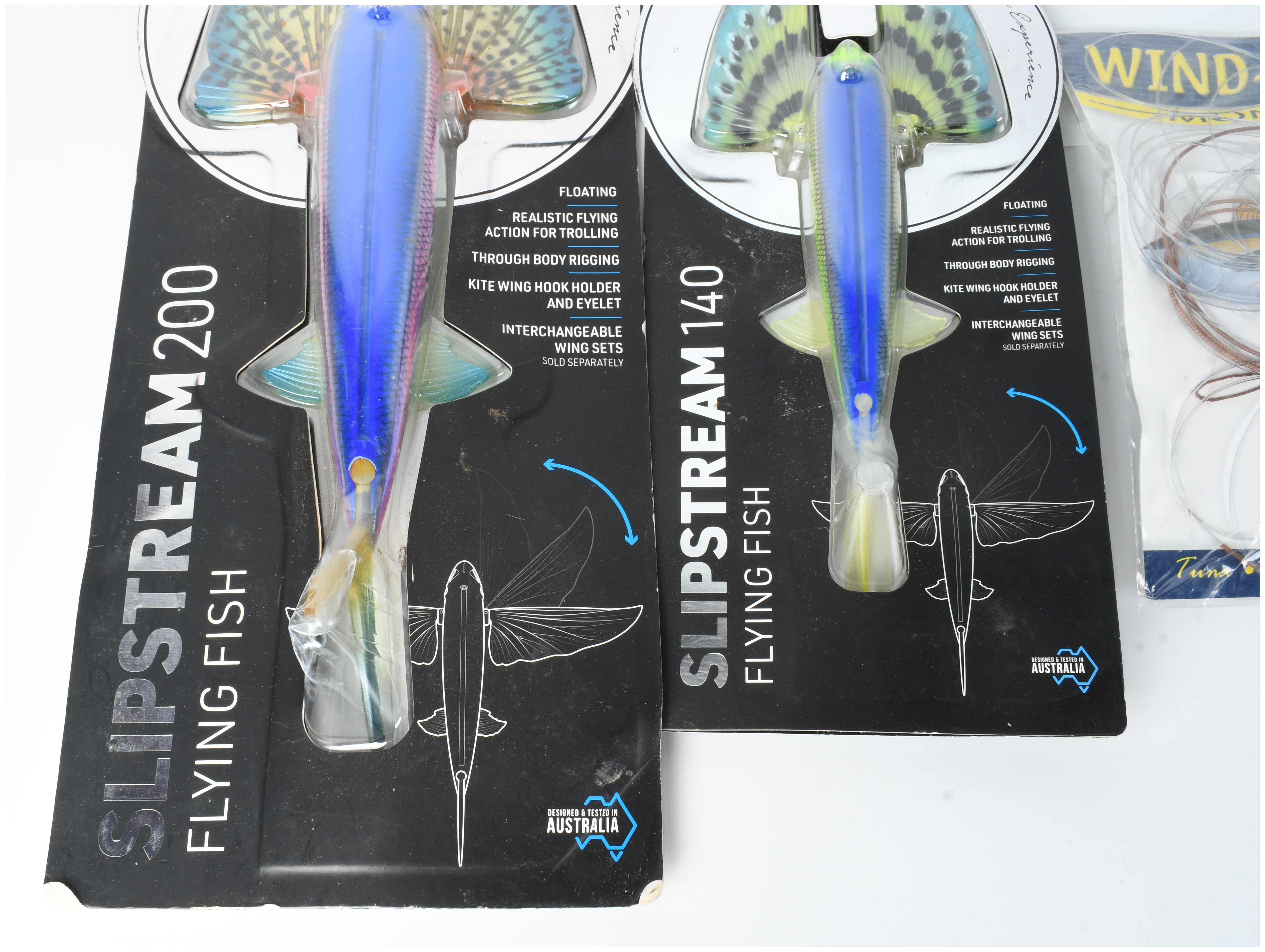 Three Pieces of Offshore Fishing Tackle Including Nomad Design Slipstream Flying Fish Lures and Diamond Leader