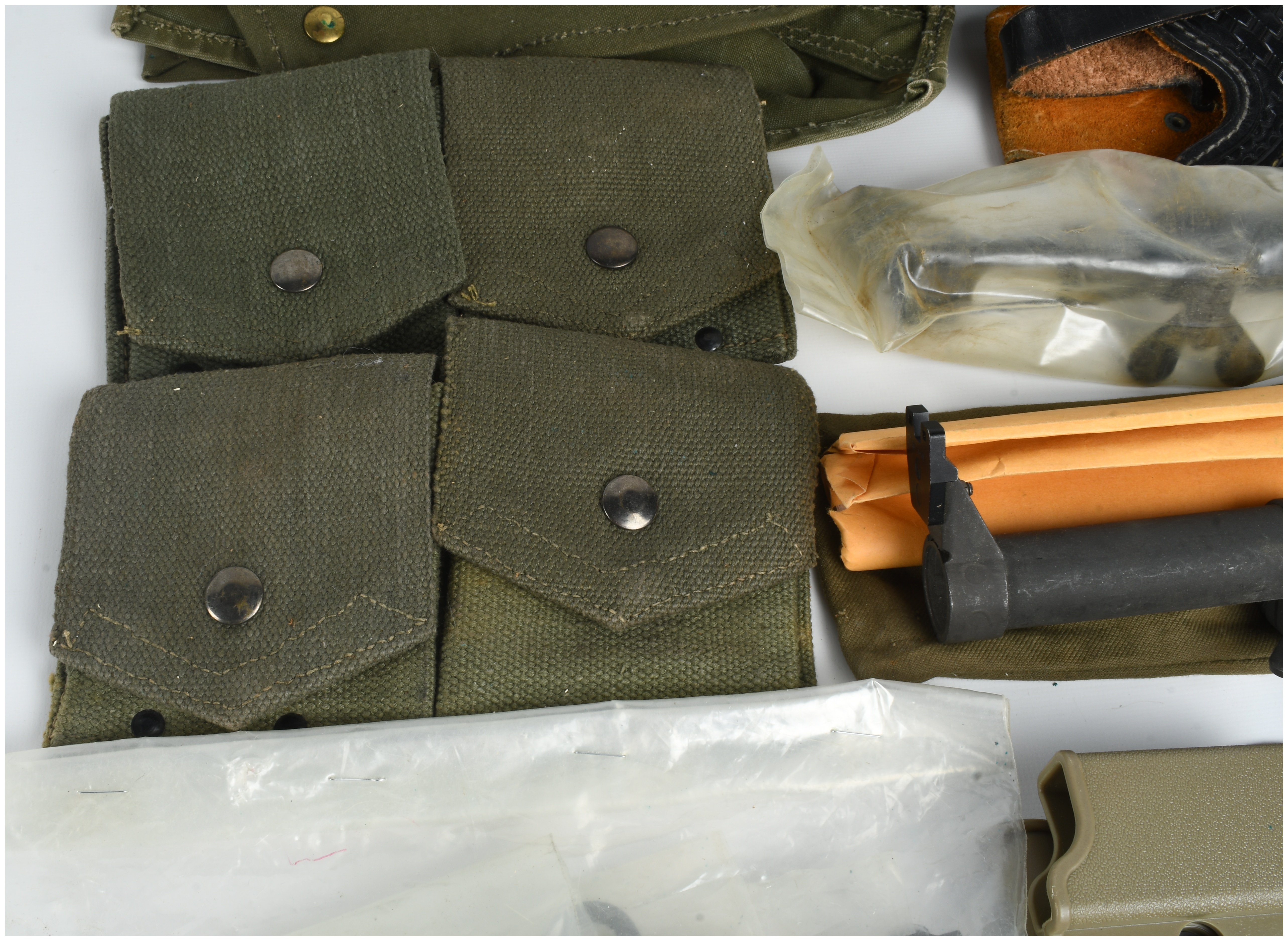 A Collection of 12 Military Firearm Accessories and Field Gear Including MAS 49 and 1911 Equipment