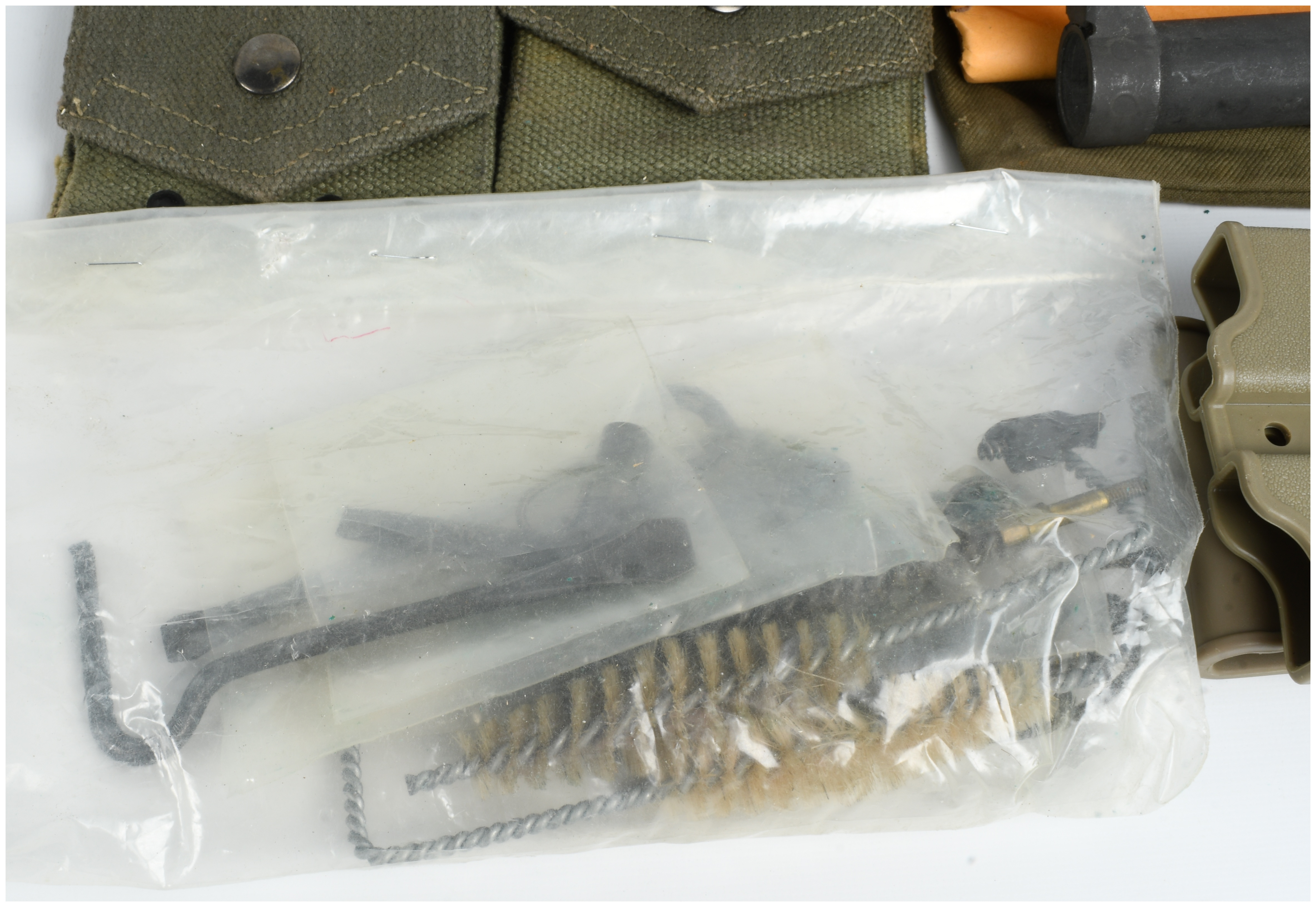 A Collection of 12 Military Firearm Accessories and Field Gear Including MAS 49 and 1911 Equipment