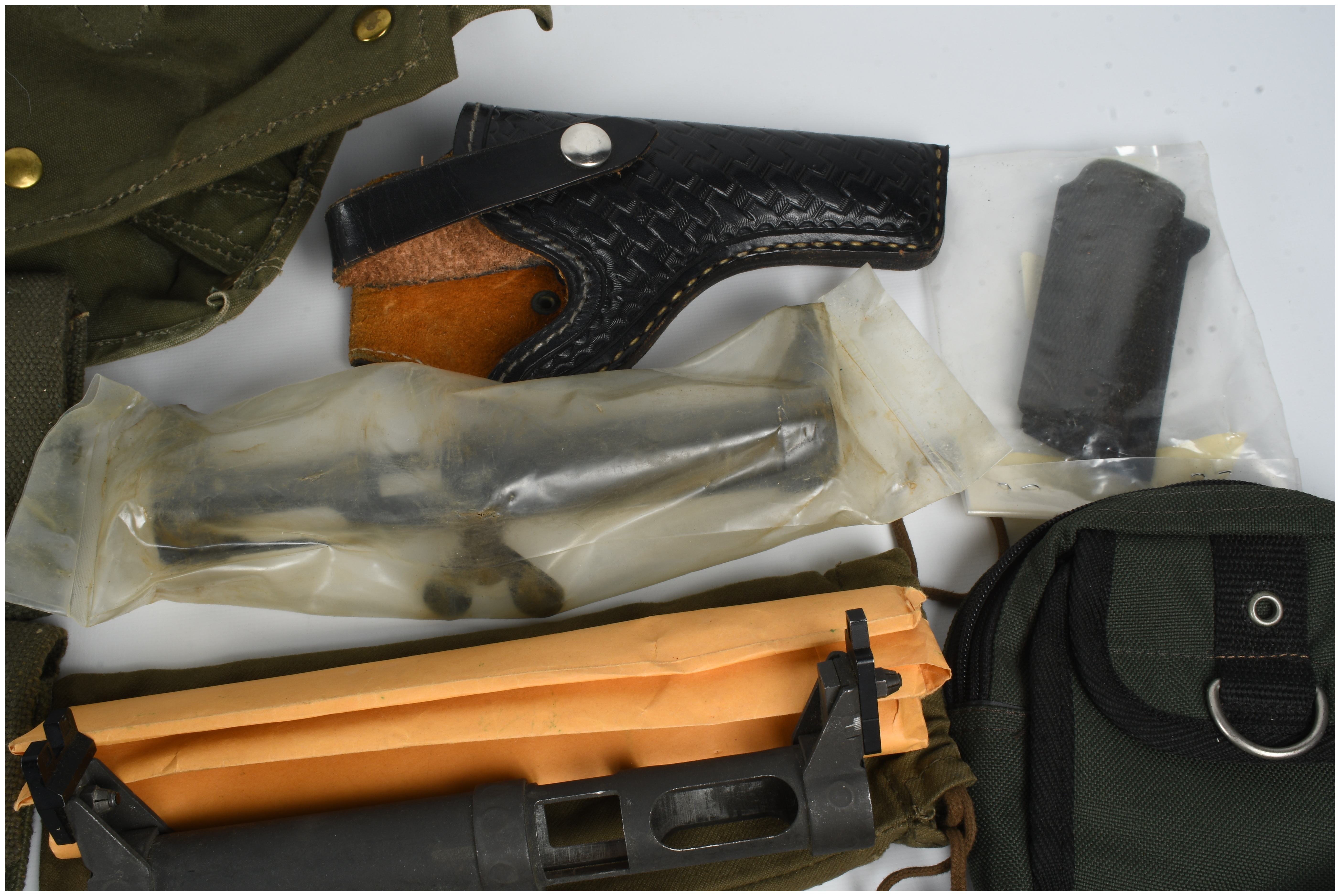 A Collection of 12 Military Firearm Accessories and Field Gear Including MAS 49 and 1911 Equipment