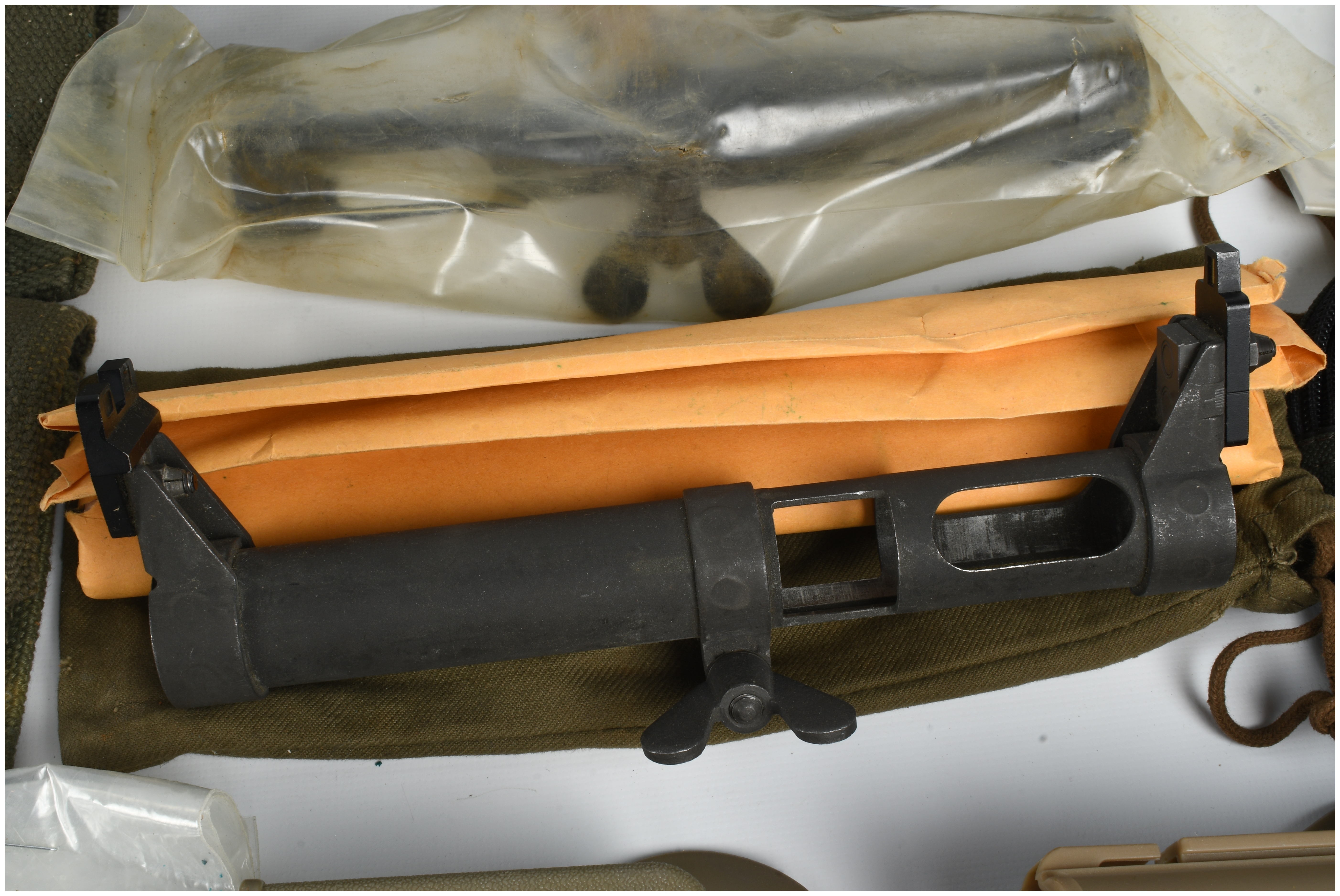 A Collection of 12 Military Firearm Accessories and Field Gear Including MAS 49 and 1911 Equipment