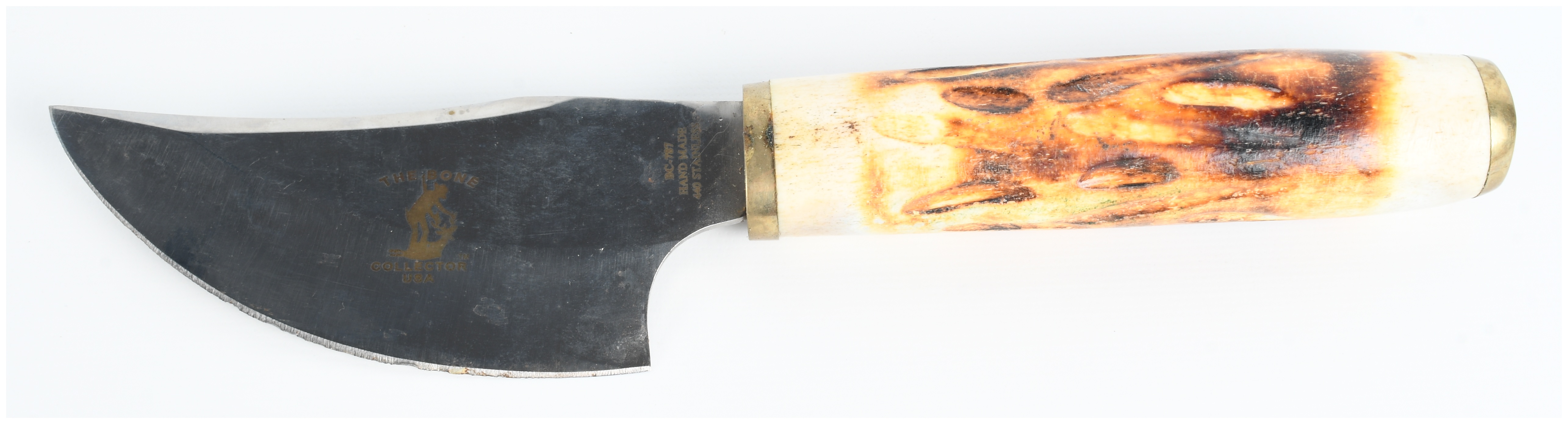 Two Items Including a Bone Collector Skinning Knife with Sheath and an Armadillo Leather Holster