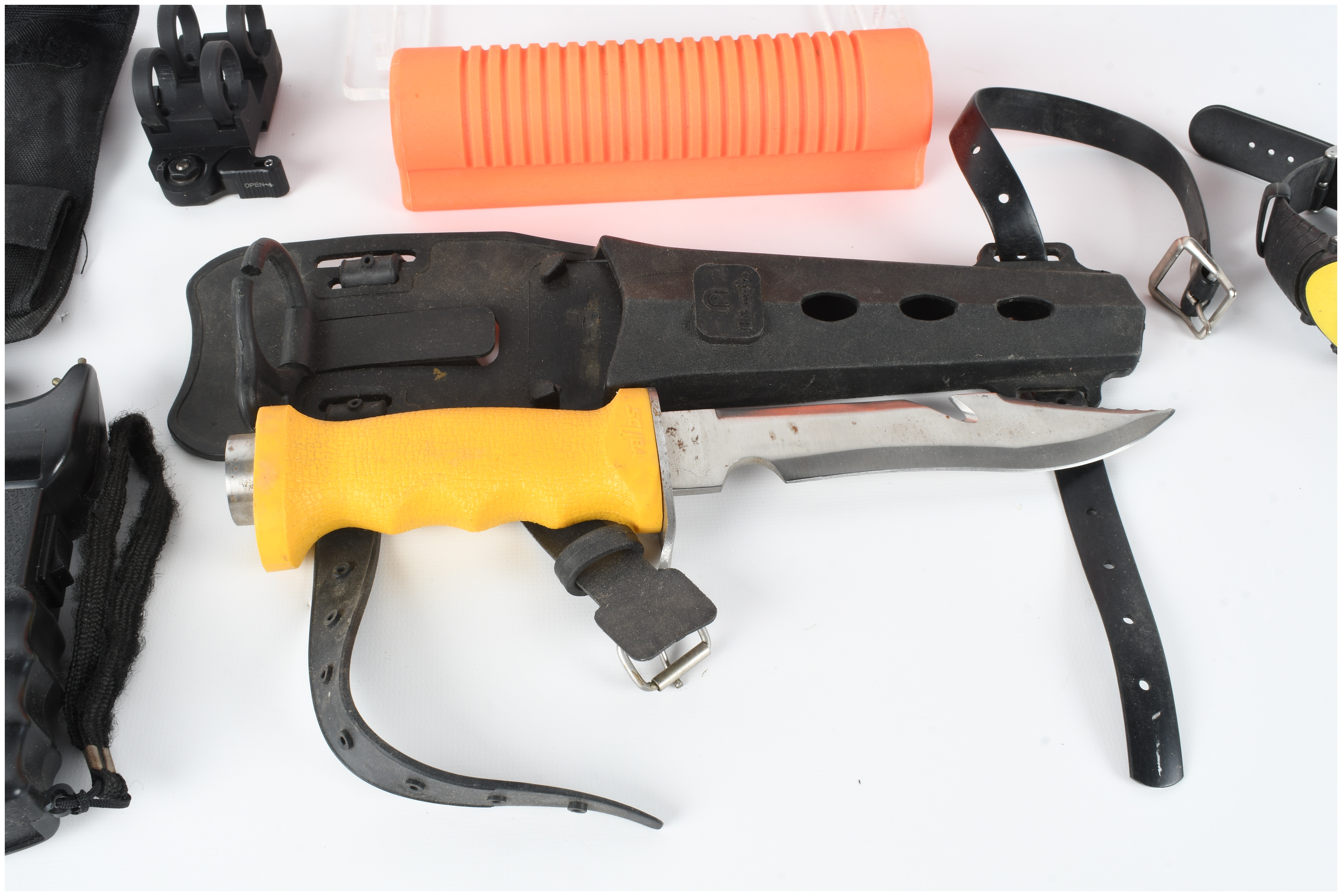 An Assortment of Personal Protection and Field Equipment including Hogue Less Lethal Shotgun Furniture