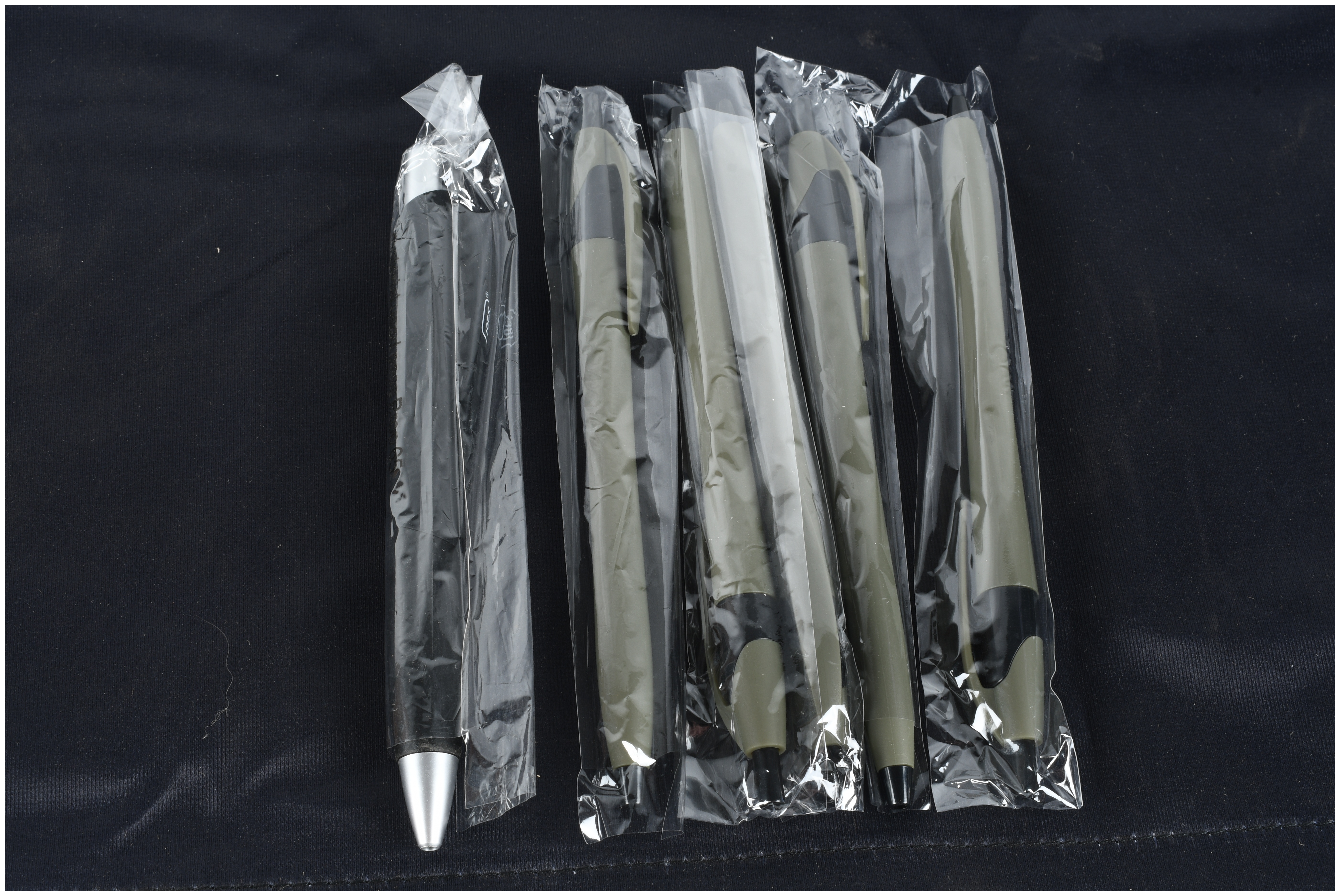A Collection of Glock and Sig Sauer Promotional Merchandise Including Banners and Pens