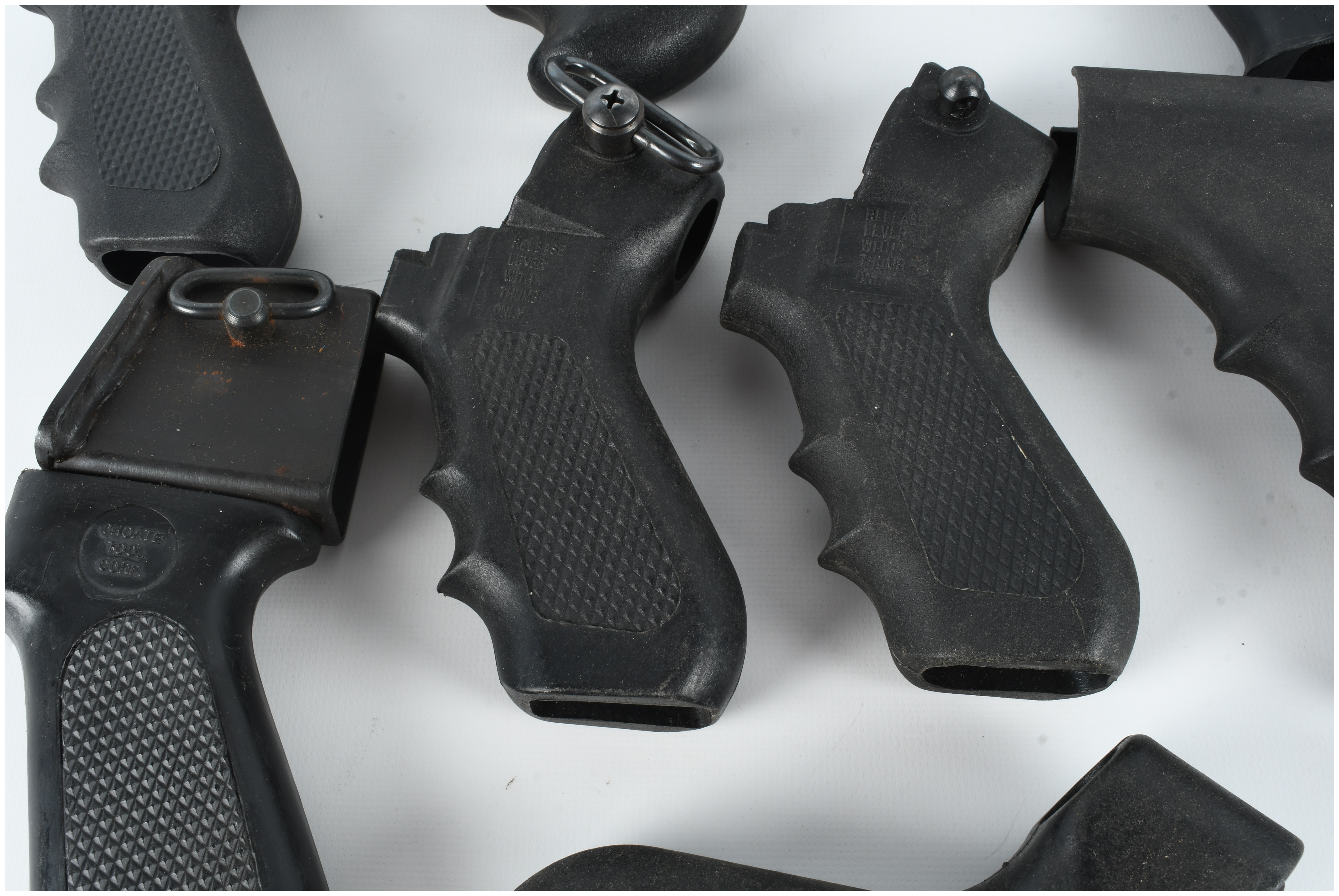 A Collection of 8 Assorted Polymer Shotgun Pistol Grips and Folding Stock Components