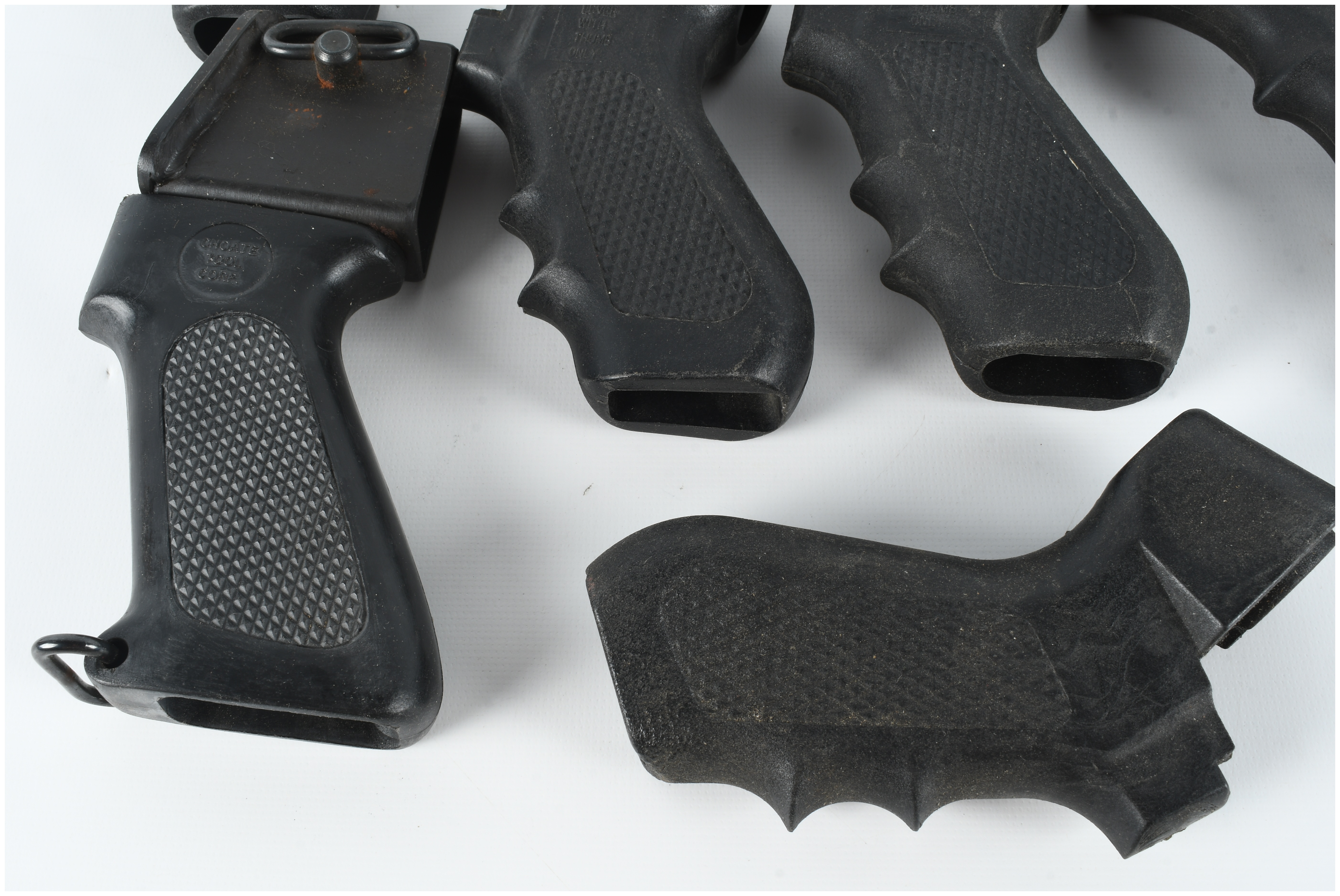 A Collection of 8 Assorted Polymer Shotgun Pistol Grips and Folding Stock Components