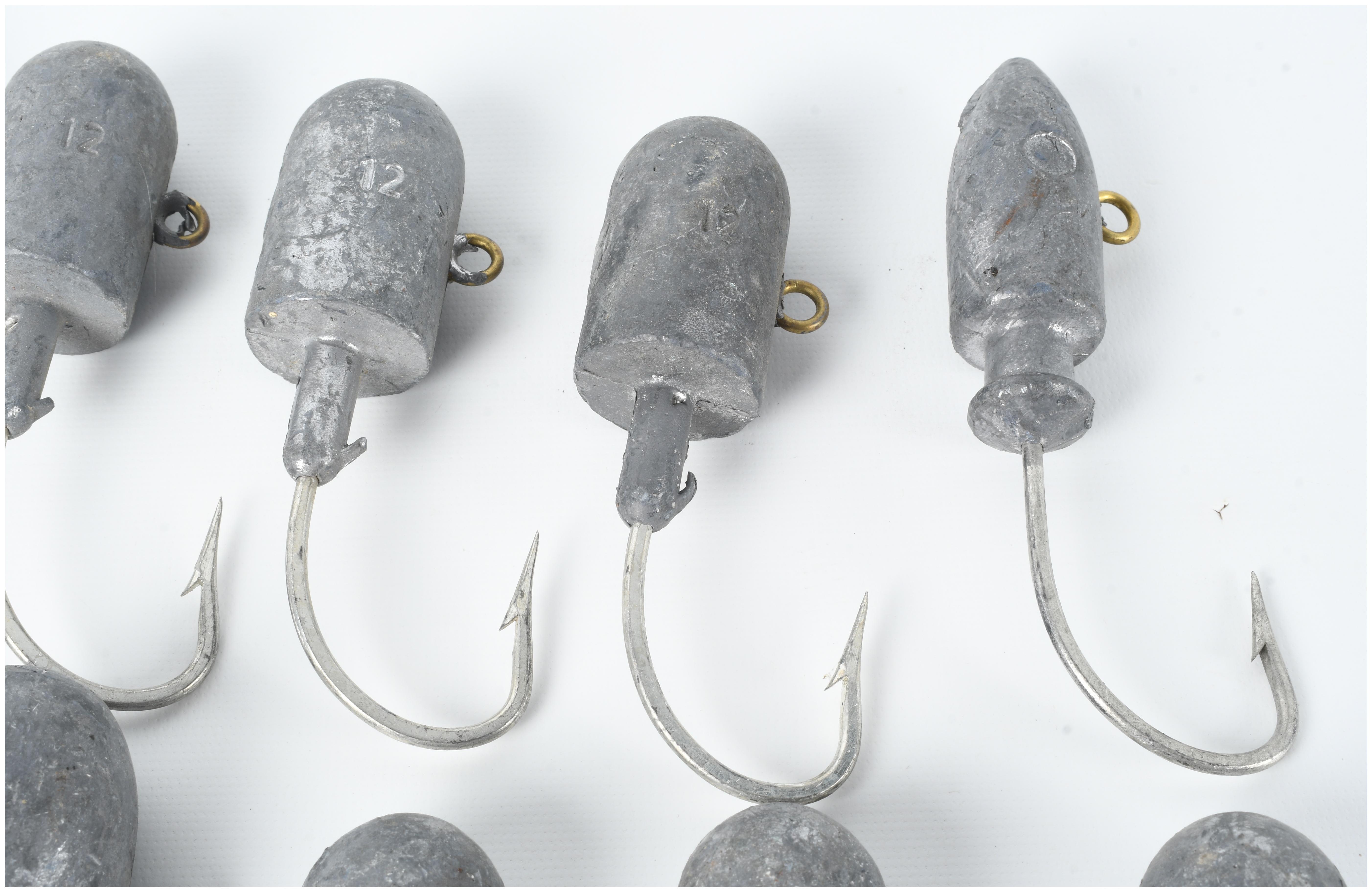 Ten Fishing Jig Heads with Embedded Lead Weights