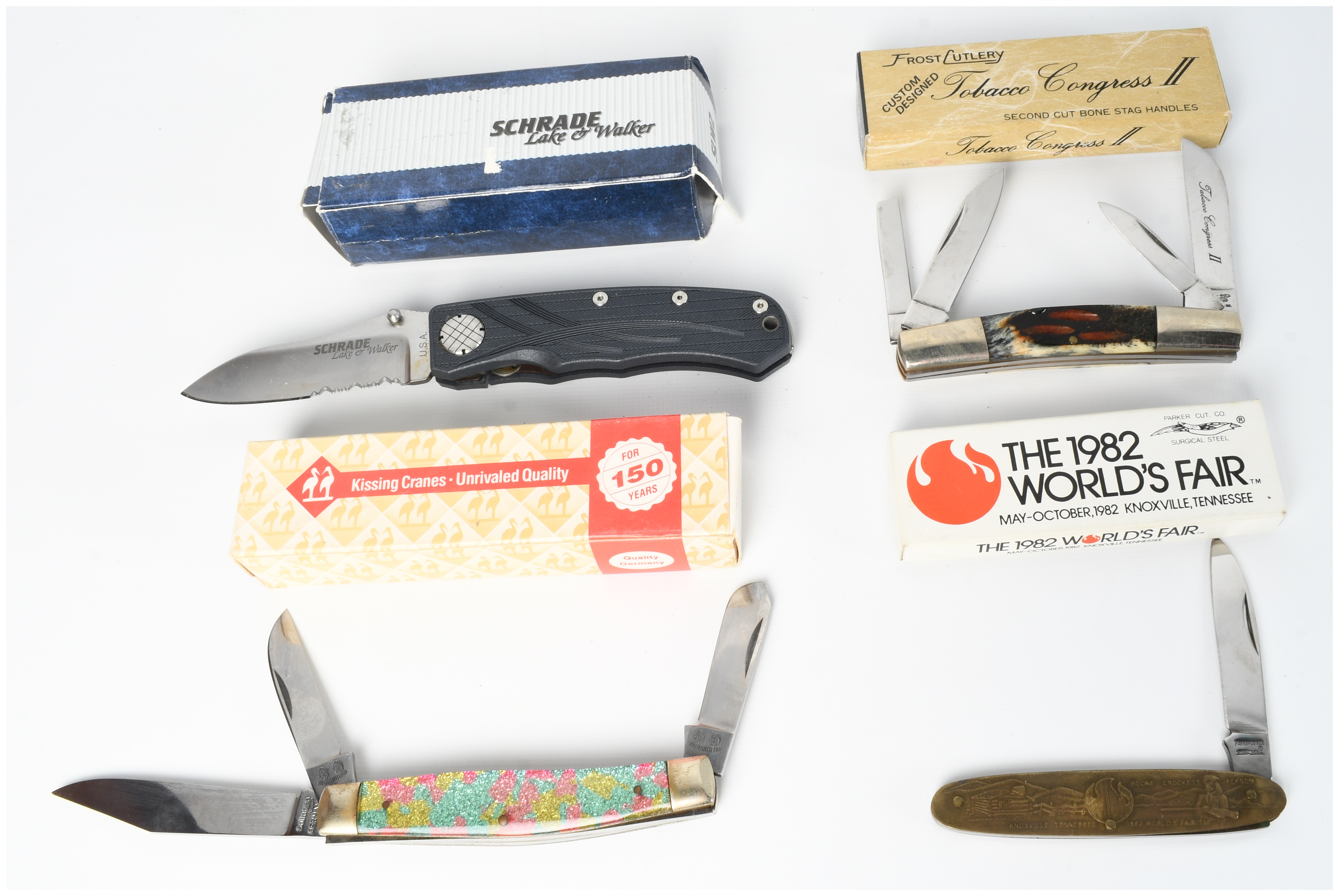 A Collection of Four Pocket Knives Including Schrade Kissing Cranes and Frost Cutlery with Boxes