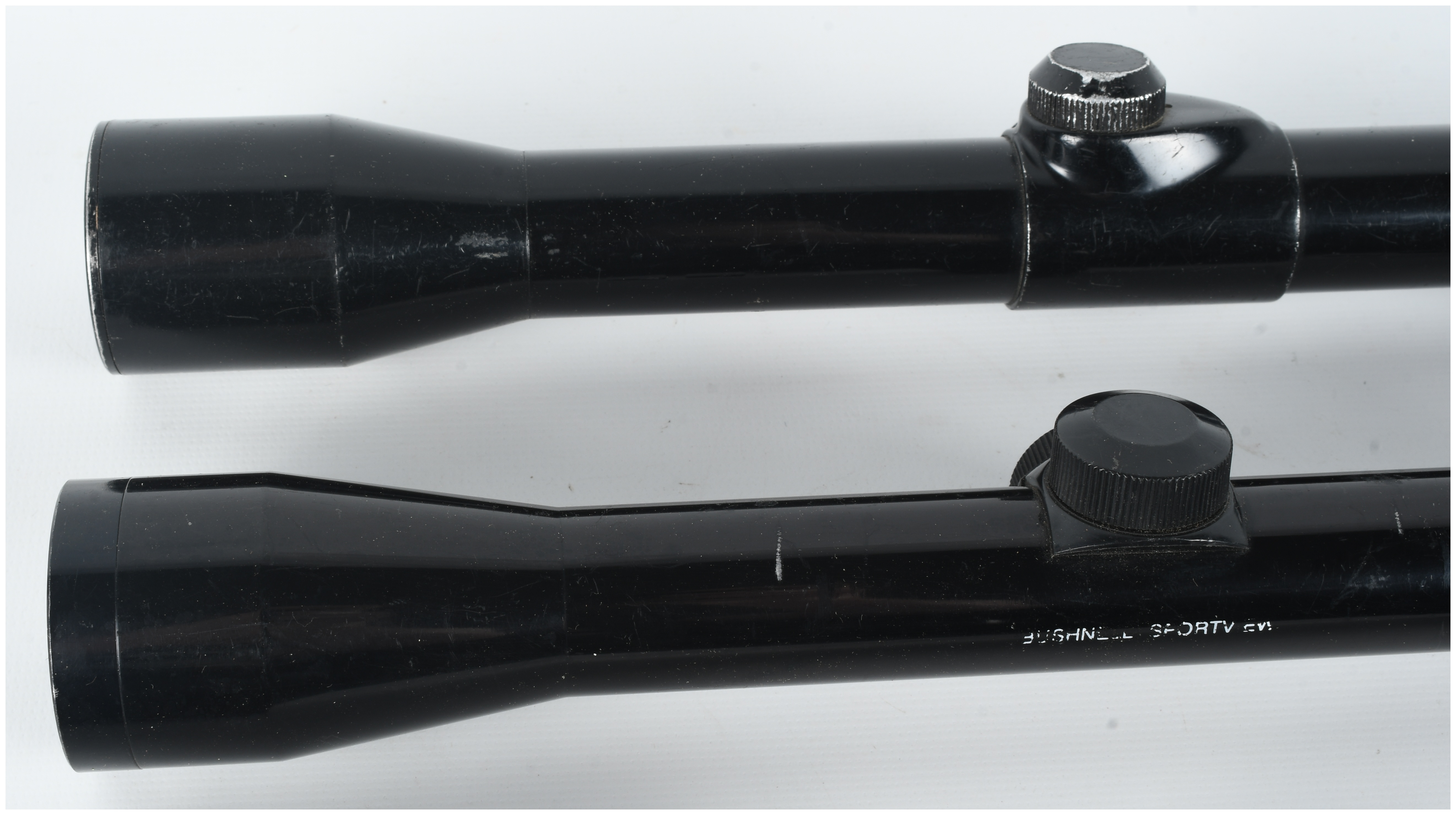 A Collection of Three Rifle Scopes Including Pecar Berlin, Bushnell Sportview, and Wesco-64