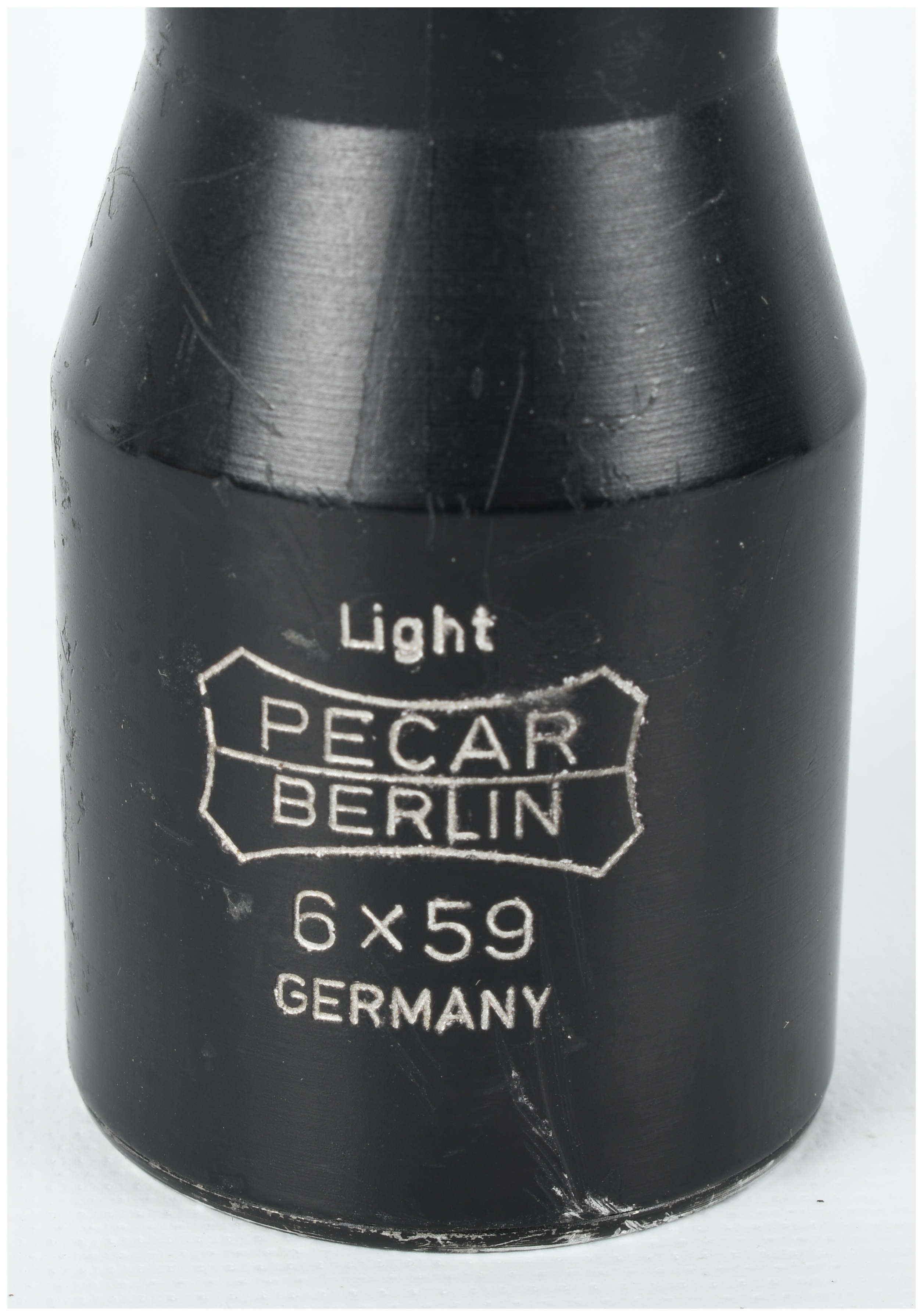 A Collection of Three Rifle Scopes Including Pecar Berlin, Bushnell Sportview, and Wesco-64