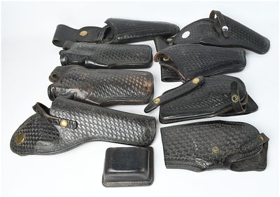 Nine Vintage American Law Enforcement Basketweave Leather Holsters. This lot consists of 9 