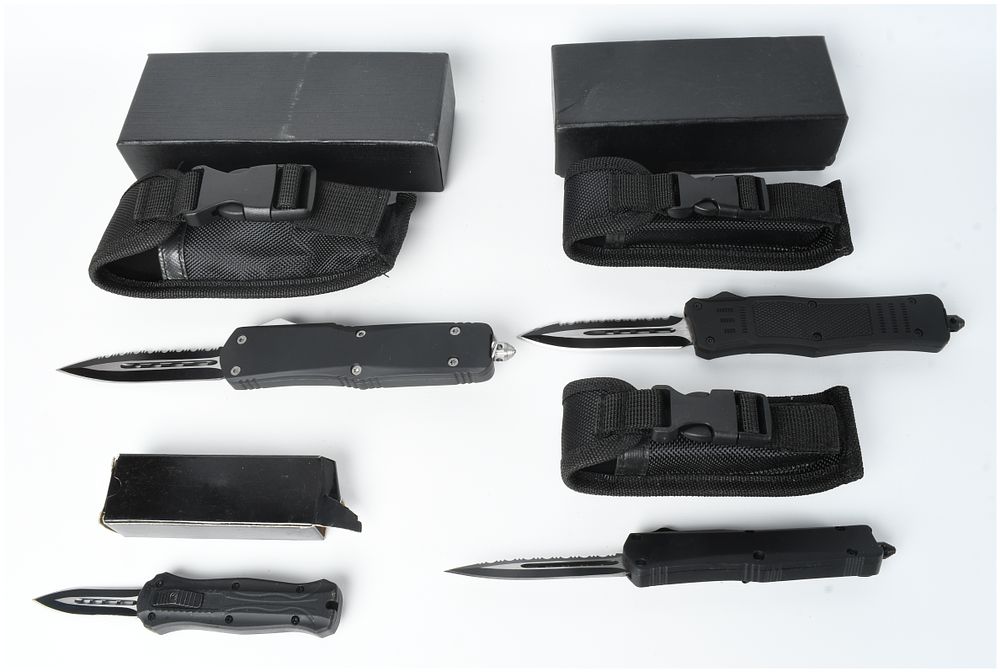 Lot 1235: A Collection of Four Gunner Gear Out-the-Front Automatic Knives