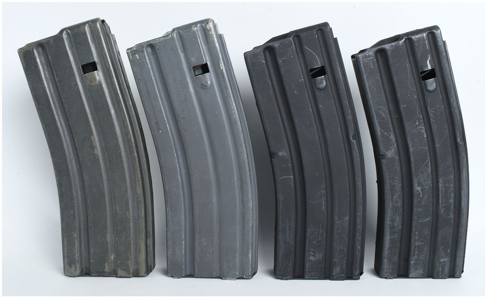 Lot 1256: Four AR-15/M16 5.56mm 30-Round Metal Magazines