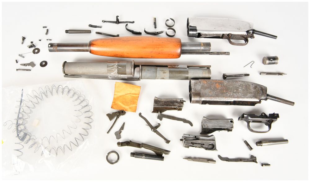 Lot 1287: A Pair of Winchester Model 12 Pump Action Shotgun Receivers and Parts 12 Gauge for Parts/Repair