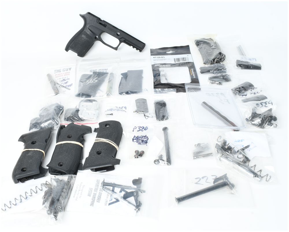 Lot 1331: A Lot of Approximately 28 Sig Sauer Handgun Parts and Accessories for P220, P226, P227, P229, P320, and P365