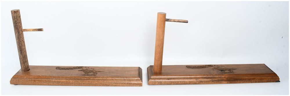 Lot 1496: A Pair of Cimarron Firearms Co. Wooden Pistol Display Stands
