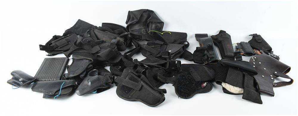 Lot 1598: A Collection of 22 Assorted Firearm Holsters and Tactical Pouches
