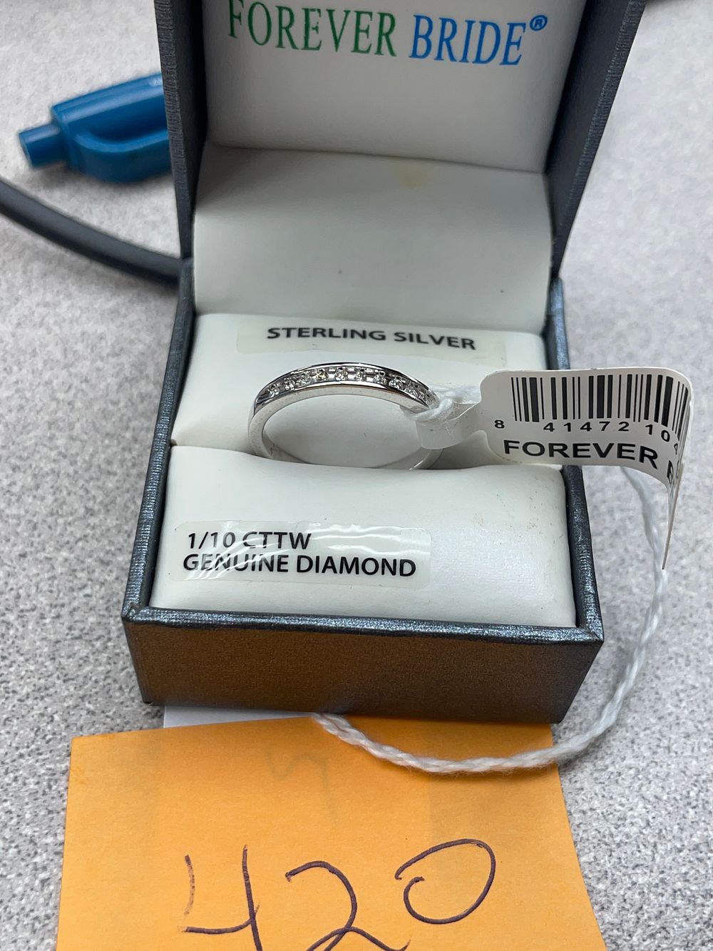 Lot 420: Sterling silver size 7 band with diamonds