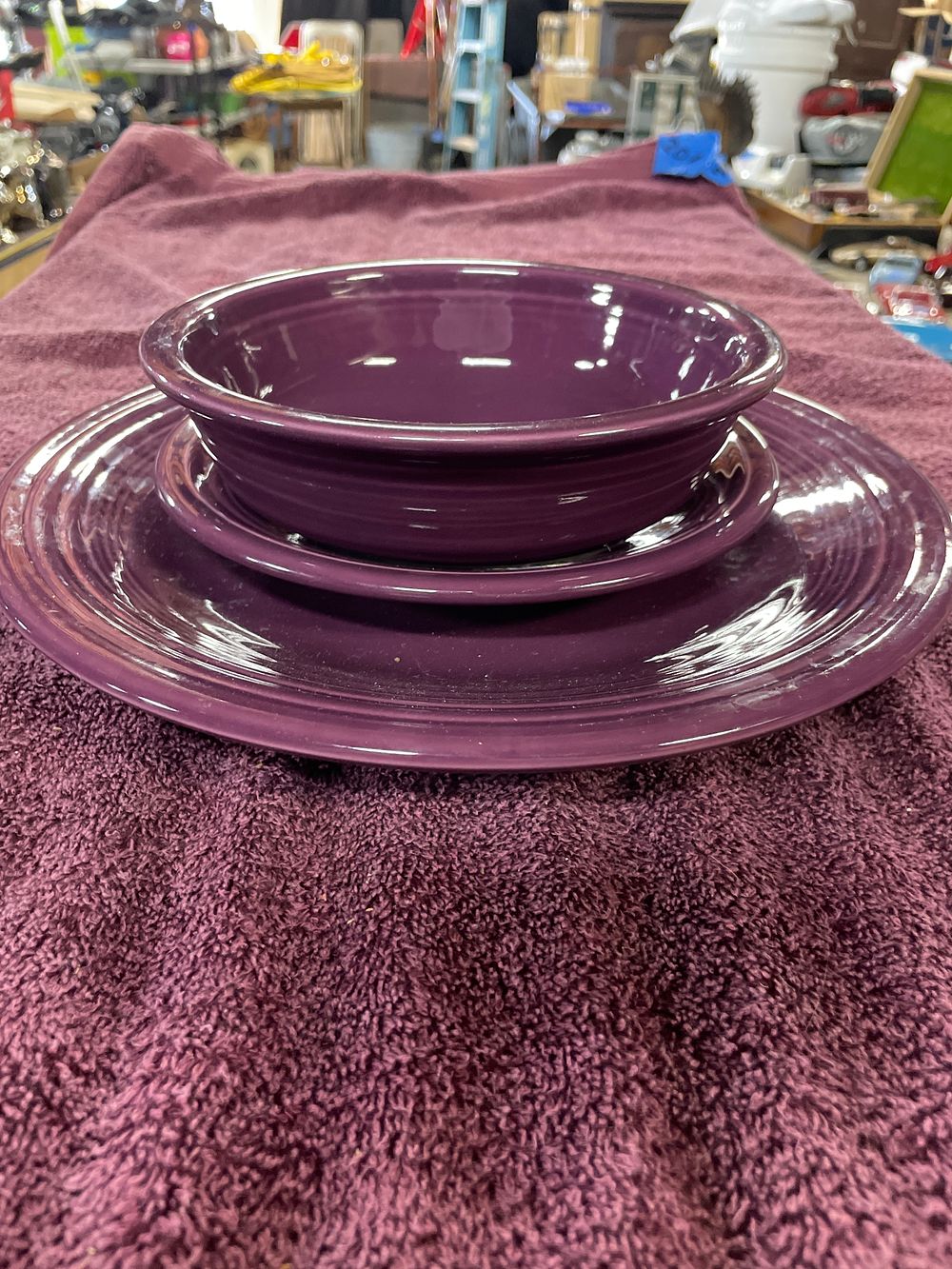Lot 170: A Fiesta Mulberry Three-Piece Bistro Coupe Place Setting