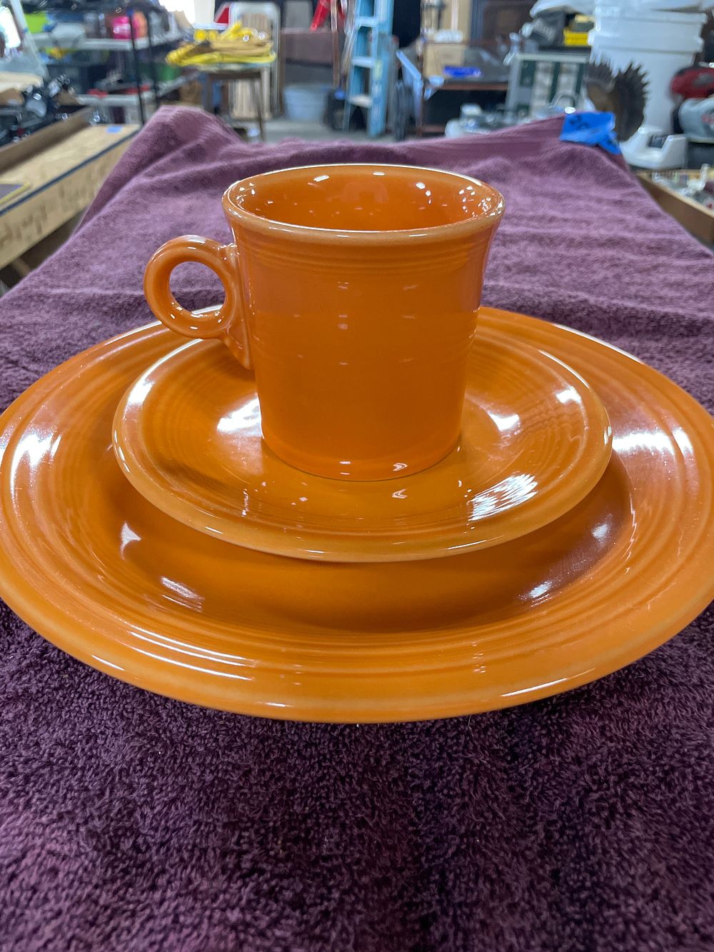 Lot 174: A Three-Piece Fiesta Tangerine Dinnerware Set by Homer Laughlin China Co.