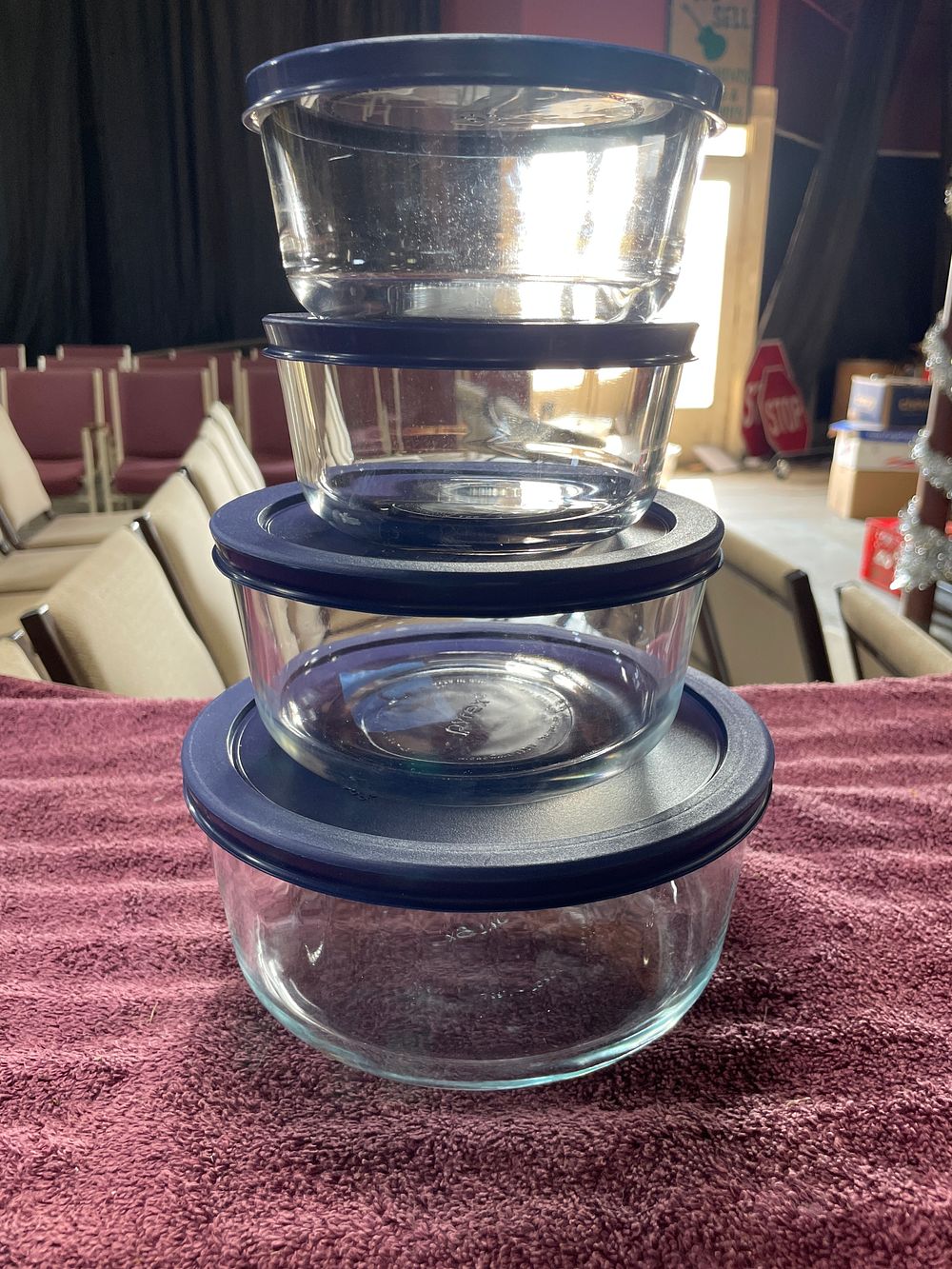 Lot 222: Four Pyrex Glass Food Storage Bowls with Dark Blue Lids
