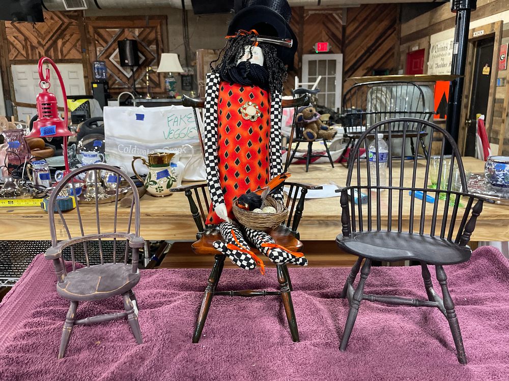 Lot 234: A Harlequin Witch Doll and Three Miniature Boyds Collection Chairs