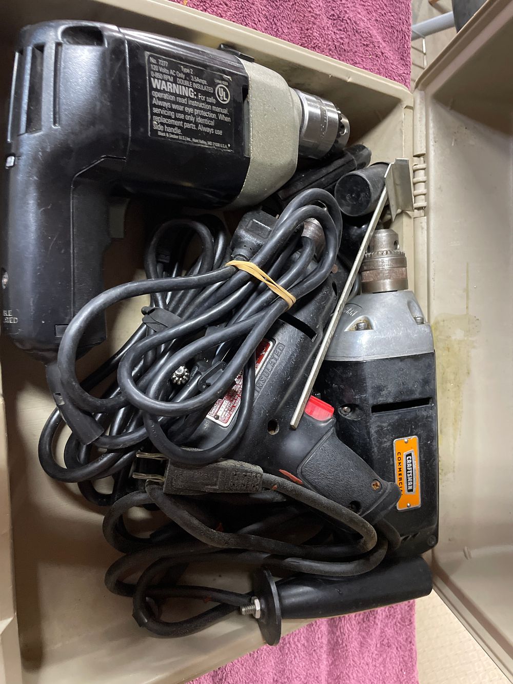 Lot 241: Three Craftsman and Black&Decker Electric Drills in Case