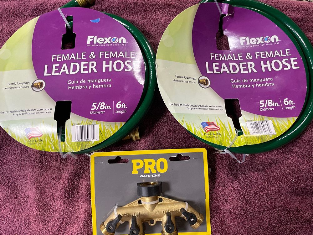 Lot 259: Two Flexon Leader Hoses and a PRO WATERING Four-Way Hose Splitter