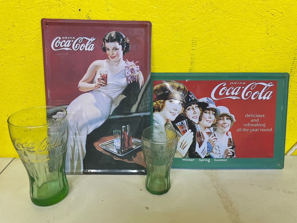 Lot 302: Three 1993 Coca-Cola Reproduction Tin Advertising Signs and Two Green Glass Tumblers