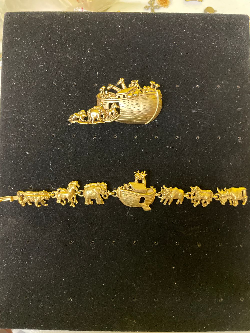 Lot 319: A Pair of AJC Noah's Ark Gold-Tone Jewelry Pieces