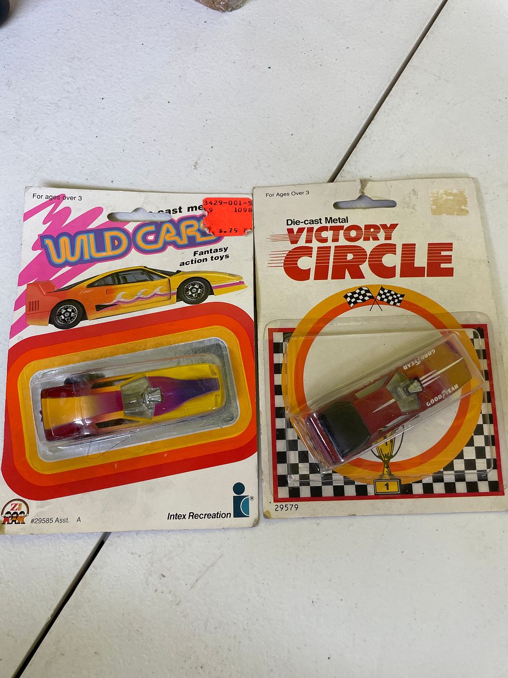Lot 333: A Pair of Intex Recreation / Zee 1/64 Scale Die-Cast Pontiac Firebird Toy Cars, 'Victory Circle Rad Bird' and 'Wild Cars Peacock Pontiac'