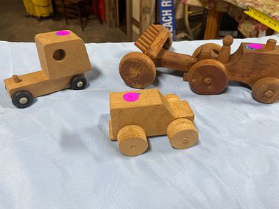 Three Natural Wood Toy Vehicles. Three natural wood toy vehicles, including a truck marked "Made 