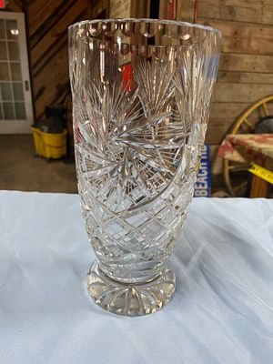A Cut Lead Crystal Pinwheel Vase. A clear crystal-cut glass vase, approximately 10 inches tall 