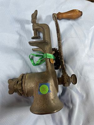 ** Antique Universal No. 2 Cast Iron Meat Grinder
**Detailed Description:** A single, dull 