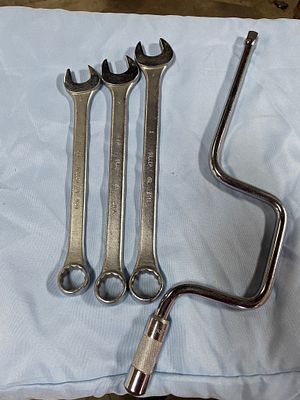 A Group of Giller Wrenches and Husky Speed Handle. A group of three silver-colored Giller 