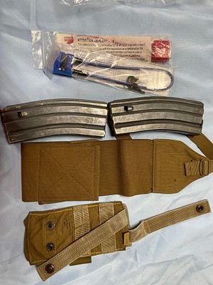Military Gear Lot with Magazines, Cummerbund, Pouch, and Locks. A lot including two dark grey 