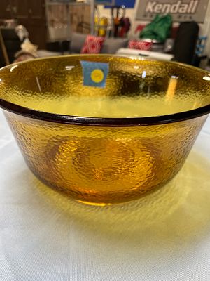 GE Amber Textured Glass Mixing Bowl. An amber-colored glass serving bowl with a dark brown rim 