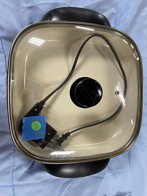 Oster CKSTSKFM12W Eco Non-stick Electric Skillet. An Oster electric skillet, black and off-white 