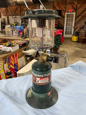 Coleman Double Mantle Propane Camping Lantern. A dark green and metallic Coleman camping lantern 