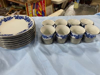 A Set of Porcelain Plates and Cups with Metal Holders. A set of 10 white porcelain plates 