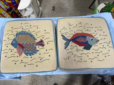 A Pair of Needlepoint Cushions with Fish Design. A pair of square needlepoint cushions, each 