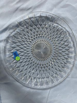 Clear Round Decorative Cut Glass Serving Plate. A clear, round, decorative cut glass plate 