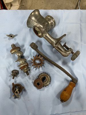 Vintage Universal No. 8 Disassembled Manual Meat Grinder. A disassembled vintage manual meat 