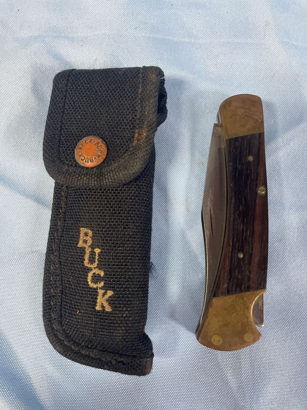 Lot 152: Buck Folding Knife with Sheath