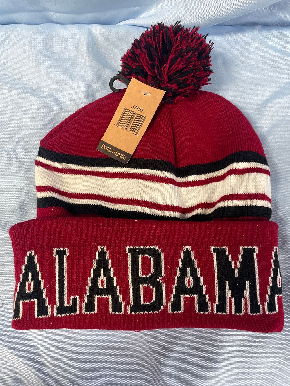 Lot 156: A Single Alabama Insulated Knitted Hat with Pom-Pom