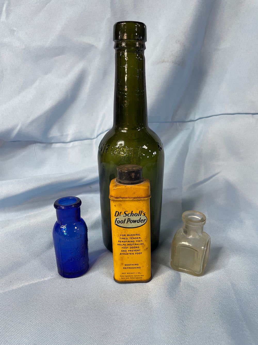 Lot 235: A Collection of Antique Glass Bottles and Dr. Scholl's Tin