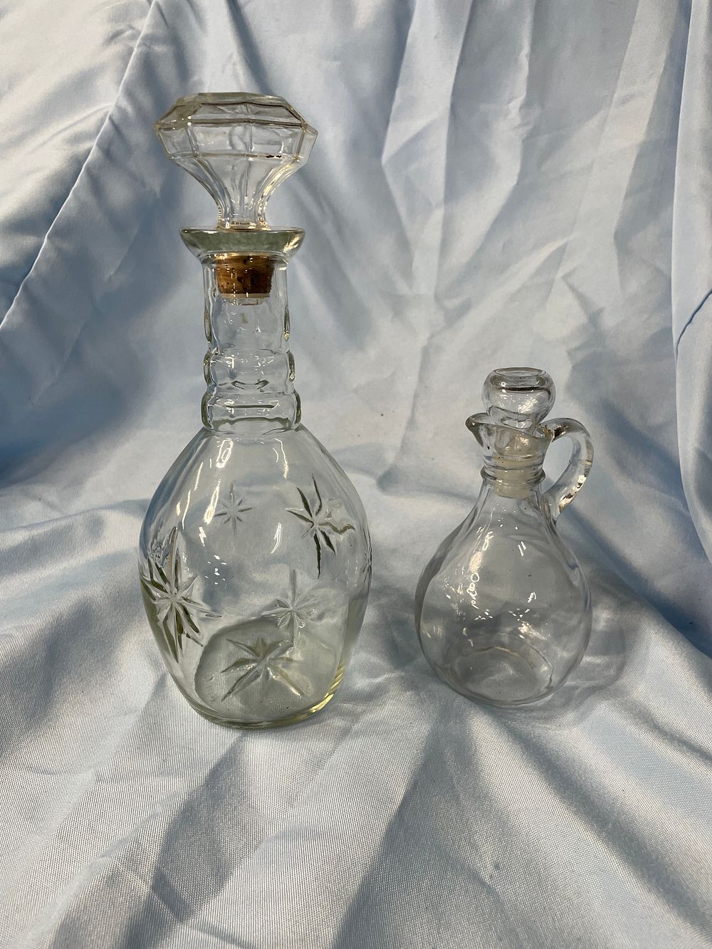 Lot 291: A Pair of Clear Glass Atomic MCM Starburst Liquor Decanters