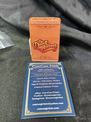 DUKES OF HAZZARD Butane Lighter New Old Stock Leather Feel. A modern, rectangular hinged butane 